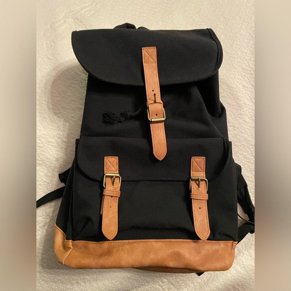 Black Canvas drawstring backpack with faux leather bottom and straps